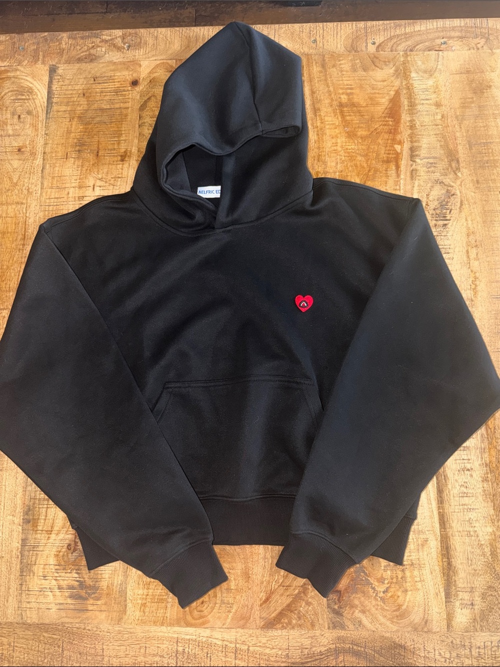 Aelfric Eden Black Hoodie with Small Red Heart Patch